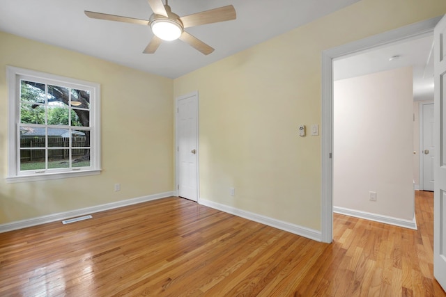 1310 E 7th Ave, Tallahassee, FL 32303 - unfurnished room featuring light wood finished floors, a ceiling fan, and baseboards