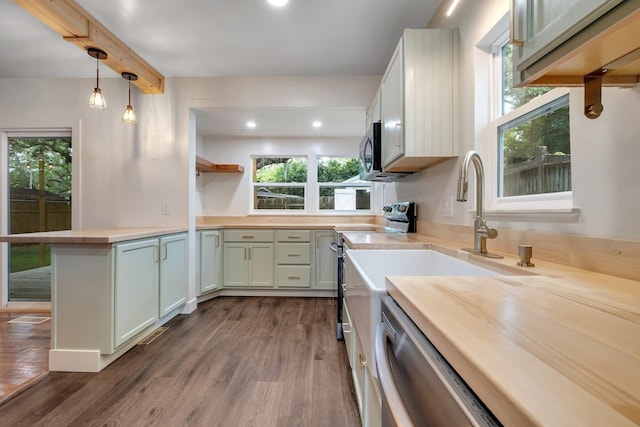1310 E 7th Ave, Tallahassee, FL 32303 - kitchen featuring open shelves, dark wood finished floors, butcher block countertops, a peninsula, and recessed lighting