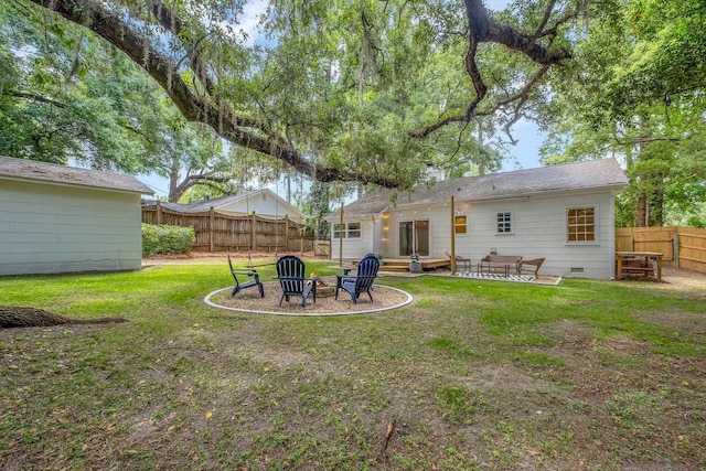 1310 E 7th Ave, Tallahassee, FL 32303 - back of house featuring an outdoor fire pit, crawl space, and a patio
