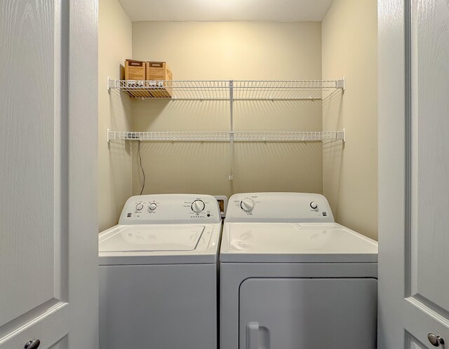 2027 Ann Arbor Ave Unit 1501, Tallahassee, FL 32304 - washroom with washing machine and clothes dryer