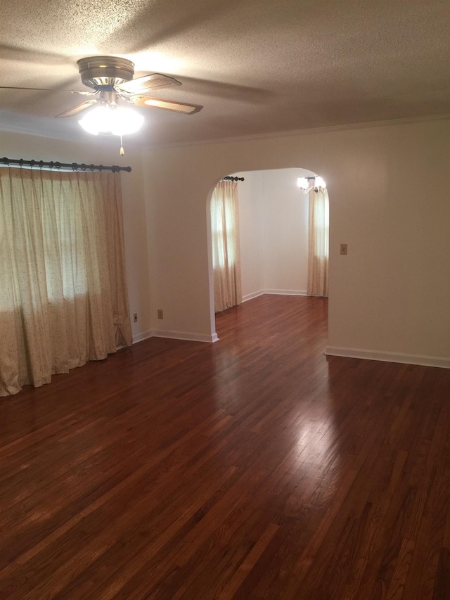 unfurnished room featuring ceiling fan, dark hardwood / wood-style flooring, and a textured ceiling