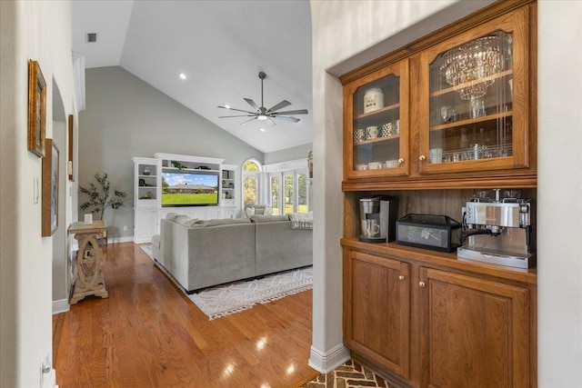 411 Worley Way, Perry, FL 32347 - living area with ceiling fan, high vaulted ceiling, wood finished floors, and recessed lighting
