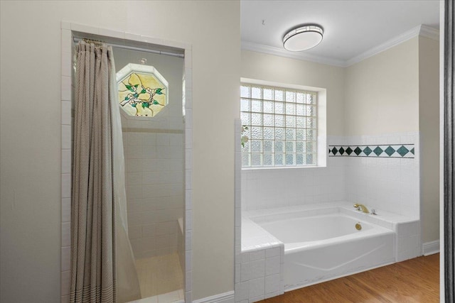 411 Worley Way, Perry, FL 32347 - bathroom featuring a bath, crown molding, wood finished floors, and a tile shower