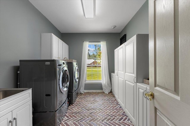 411 Worley Way, Perry, FL 32347 - laundry area with independent washer and dryer, cabinet space, and brick patterned flooring