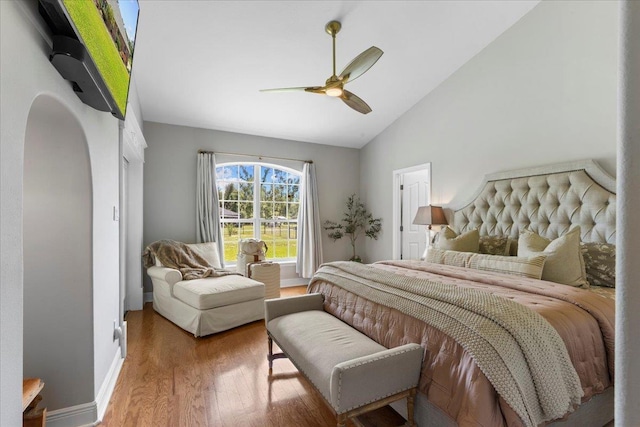 411 Worley Way, Perry, FL 32347 - bedroom featuring wood finished floors, ceiling fan, arched walkways, and high vaulted ceiling