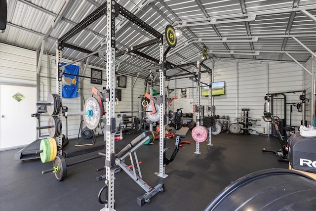 411 Worley Way, Perry, FL 32347 - exercise room featuring a garage, vaulted ceiling, and metal wall