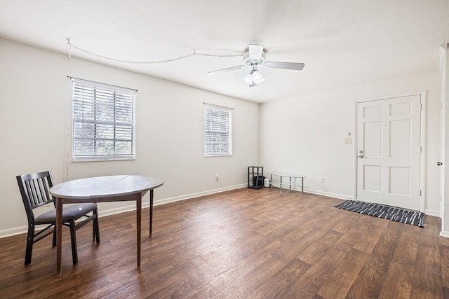 interior space featuring ceiling fan and dark hardwood / wood-style flooring