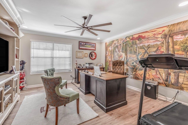 home office featuring crown molding, light wood-type flooring, and ceiling fan