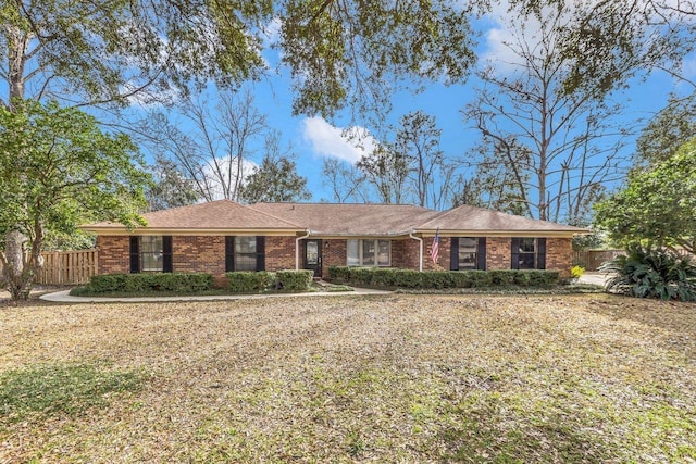 ranch-style house with a front lawn