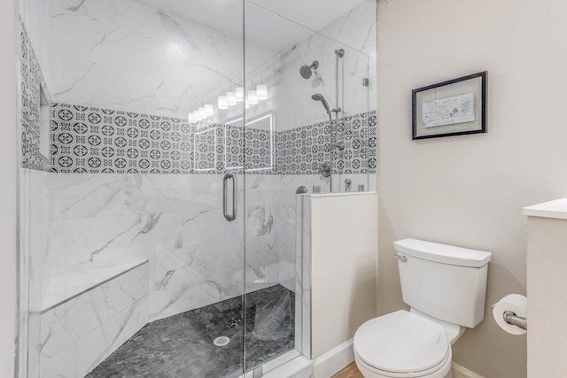 bathroom with walk in shower and toilet