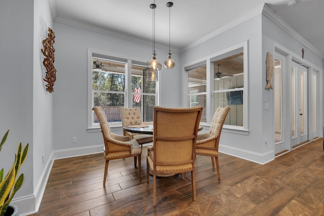 dining area featuring crown molding, dark hardwood / wood-style floors, and ceiling fan