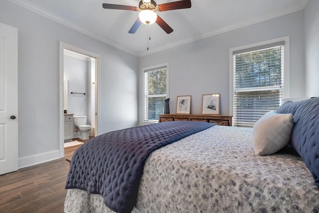 bedroom with crown molding, dark wood-type flooring, ceiling fan, and ensuite bathroom