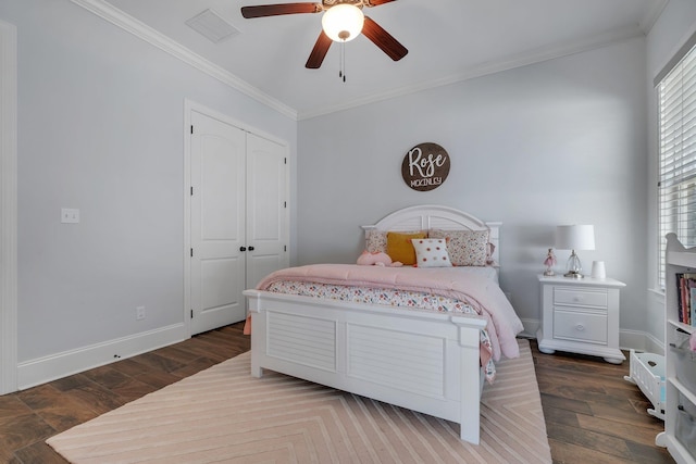 bedroom featuring ornamental molding, dark hardwood / wood-style flooring, and a closet