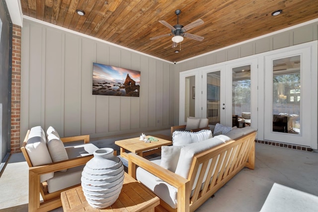 living room with french doors, ceiling fan, and wooden ceiling