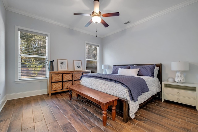 bedroom featuring crown molding, dark hardwood / wood-style floors, and ceiling fan