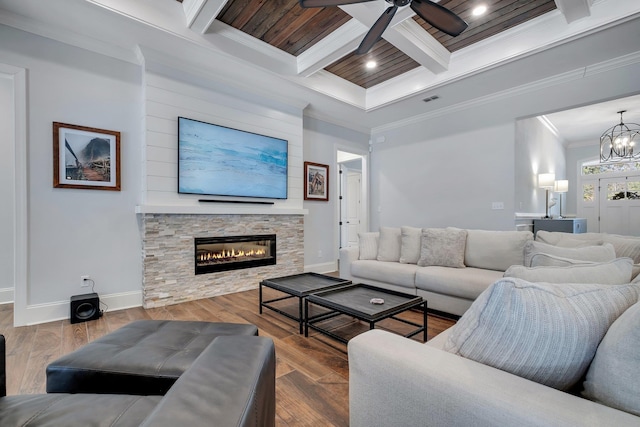 living room with hardwood / wood-style flooring, crown molding, coffered ceiling, and beam ceiling