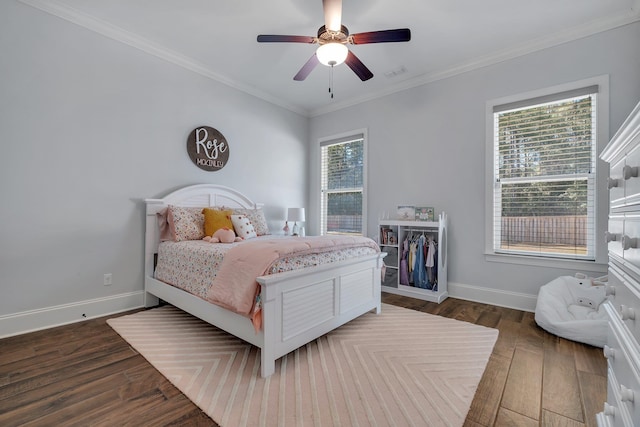 bedroom featuring ceiling fan, ornamental molding, and dark hardwood / wood-style flooring