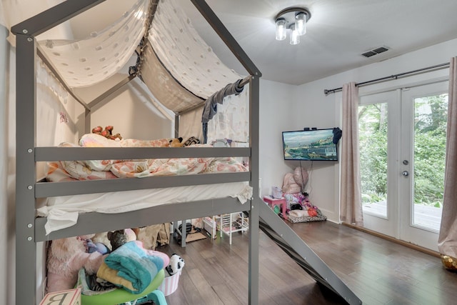 2414 Glenshire Ln, Tallahassee, FL 32308 - bedroom with access to outside and wood finished floors
