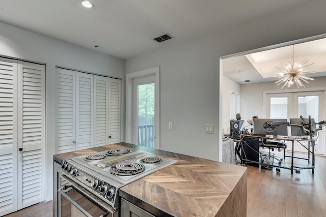2414 Glenshire Ln, Tallahassee, FL 32308 - kitchen featuring stove, a chandelier, wood finished floors, an office area, and recessed lighting