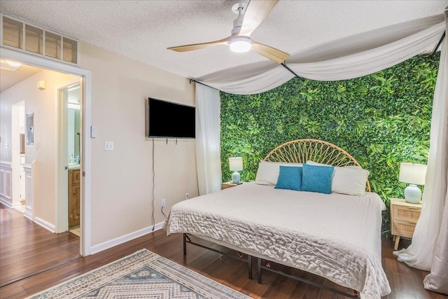 bedroom featuring ceiling fan, a textured ceiling, and hardwood / wood-style floors