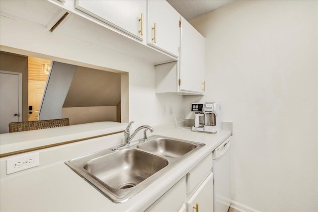 kitchen featuring white cabinetry, sink, and dishwasher