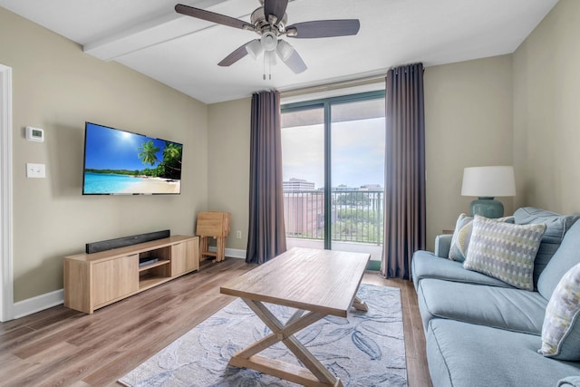 300 S Duval St Unit 1210, Tallahassee, FL 32301 - living area with light wood-style flooring, a ceiling fan, and beamed ceiling