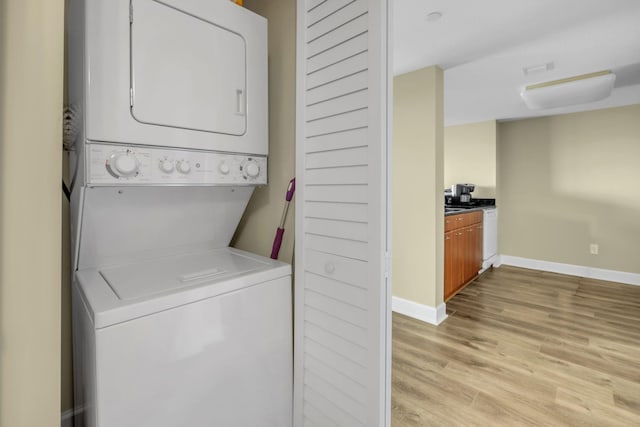 300 S Duval St Unit 1210, Tallahassee, FL 32301 - laundry room with stacked washer and clothes dryer and light wood-style flooring