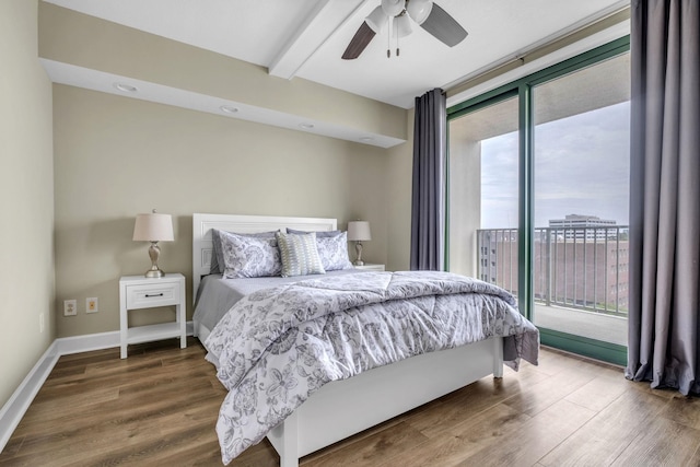 300 S Duval St Unit 1210, Tallahassee, FL 32301 - bedroom with multiple windows, beam ceiling, access to exterior, and wood finished floors