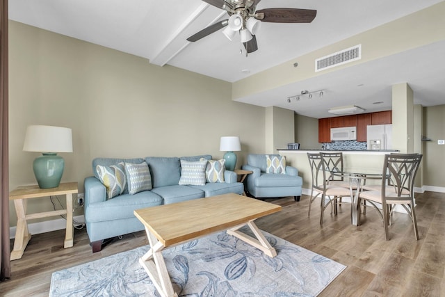 300 S Duval St Unit 1210, Tallahassee, FL 32301 - living area featuring light wood-style flooring, a ceiling fan, beamed ceiling, and rail lighting
