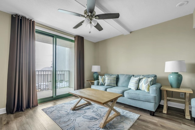 300 S Duval St Unit 1210, Tallahassee, FL 32301 - living room featuring healthy amount of natural light, ceiling fan, wood finished floors, and beam ceiling