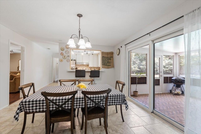 dining area with a notable chandelier