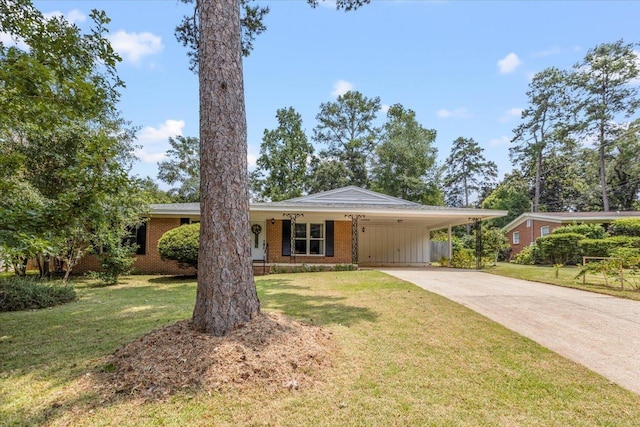 single story home with brick siding, an attached carport, concrete driveway, and a front yard