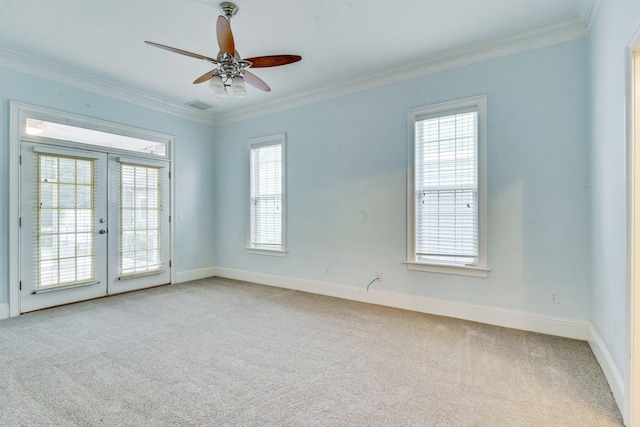 empty room with light carpet, french doors, and ornamental molding
