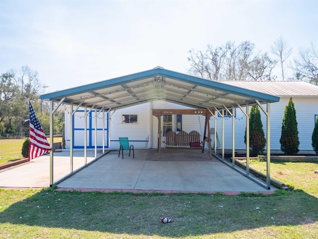 view of parking / parking lot featuring a carport and driveway