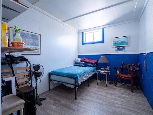 bedroom with wood finished floors