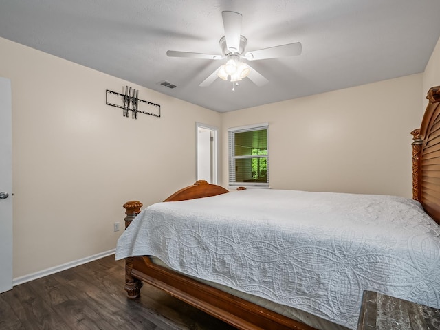bedroom with visible vents, ceiling fan, wood finished floors, and baseboards