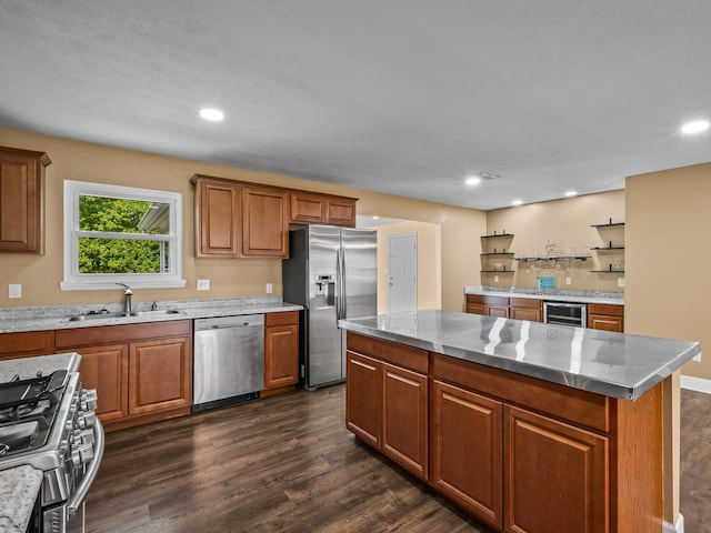 kitchen with a sink, dark wood-style flooring, stainless steel appliances, wine cooler, and brown cabinetry
