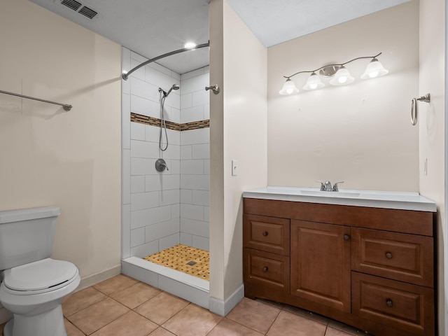 full bath with a tile shower, visible vents, baseboards, toilet, and tile patterned flooring