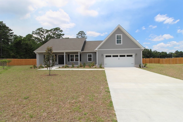 view of front of home with a garage and a front yard