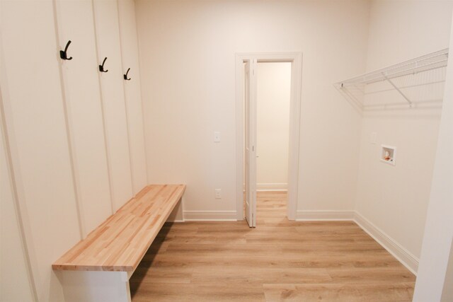 mudroom with light hardwood / wood-style flooring