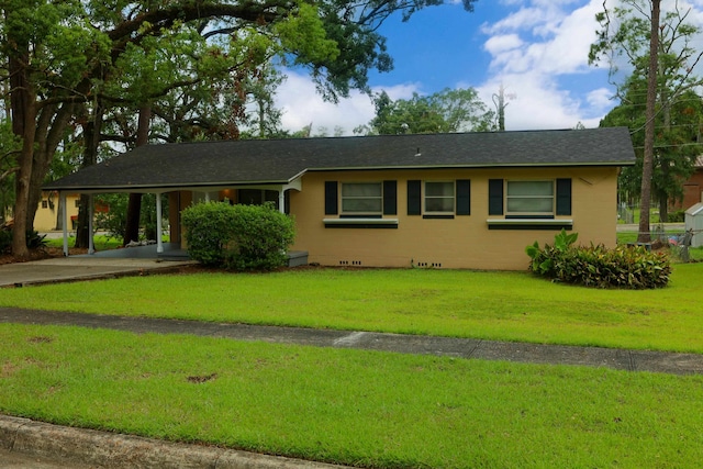 ranch-style house with a front lawn