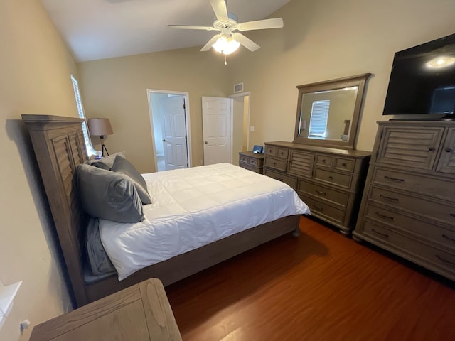 bedroom with lofted ceiling, dark hardwood / wood-style floors, and ceiling fan