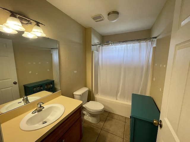 full bathroom with shower / tub combo with curtain, vanity, tile patterned floors, and toilet