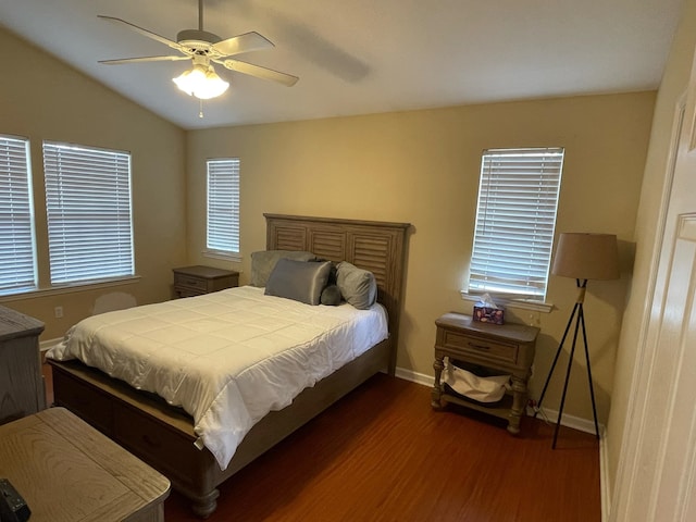 bedroom featuring lofted ceiling, dark hardwood / wood-style floors, and ceiling fan