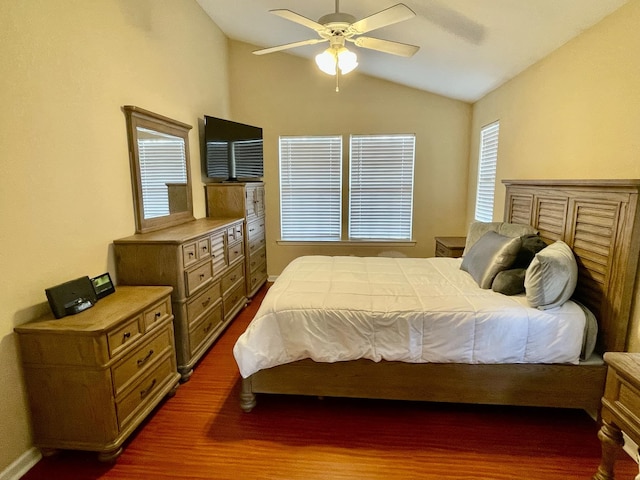 bedroom featuring lofted ceiling, dark wood-type flooring, and ceiling fan