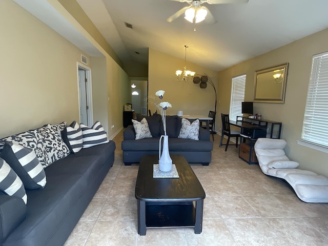 living room featuring tile patterned flooring, ceiling fan with notable chandelier, and vaulted ceiling