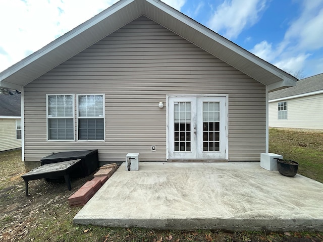 back of property with french doors and a patio area