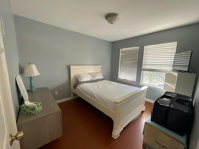 bedroom featuring dark wood-type flooring