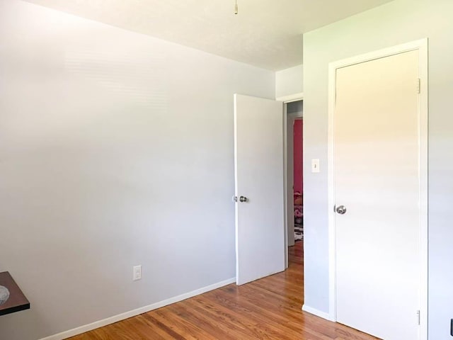 2105 Belle Vue Way, Tallahassee, FL 32304 - unfurnished bedroom with wood finished floors and baseboards