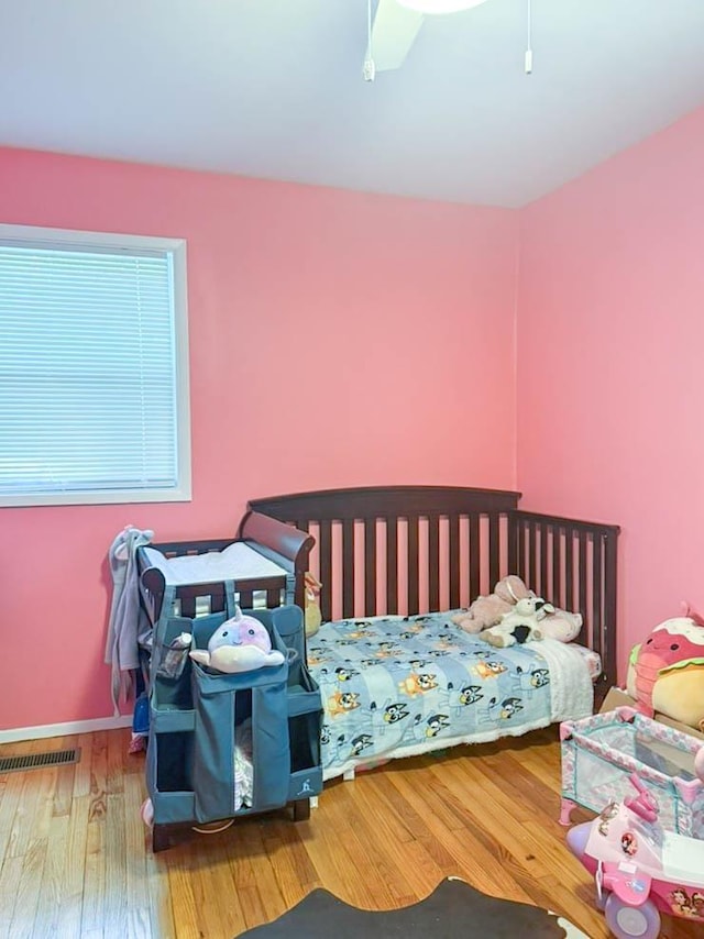 2105 Belle Vue Way, Tallahassee, FL 32304 - bedroom with hardwood / wood-style flooring, ceiling fan, and baseboards